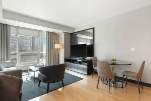 black flat screen tv on black wooden tv rack